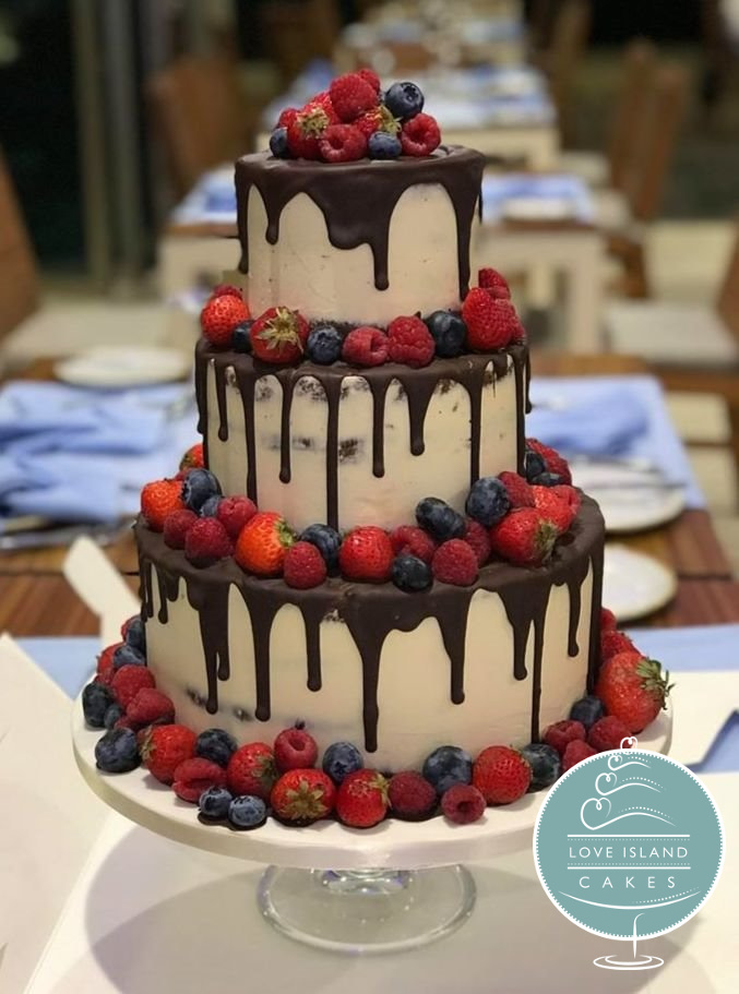 Semi naked with chocolate drips and fresh berries