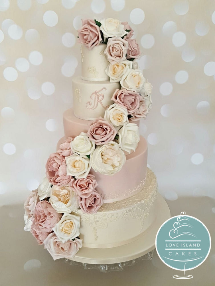 pink and lustre lace with full cascade of artificial flowers